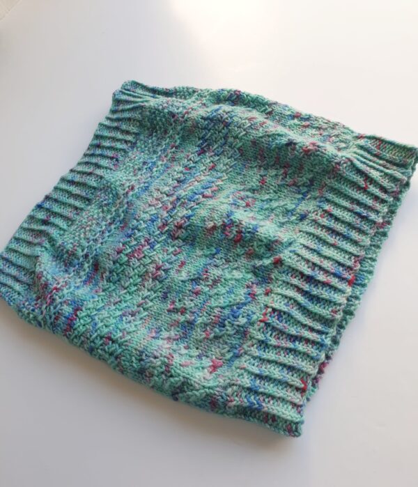 textured cowl pattern knitted in green and purple yarn