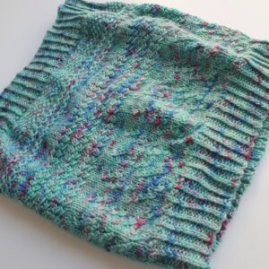 hand knitted textured cowl in green and purple yarn