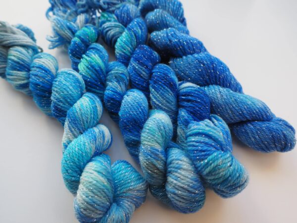 hand dyed gradient min skeins of yarn on a merino lurex base in blue colours