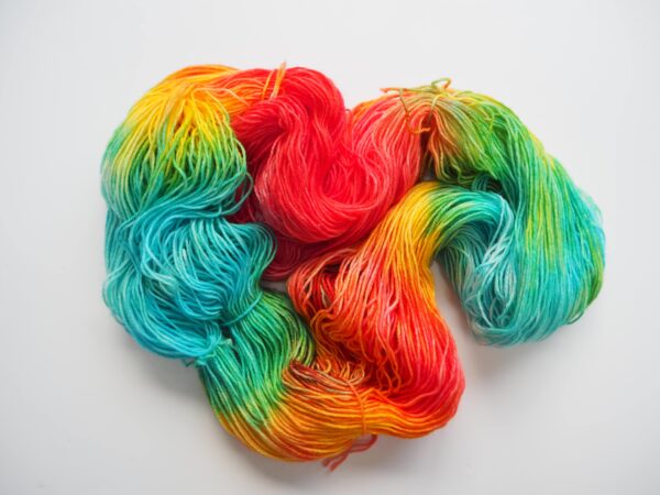 hand dyed yarn in blue, yellow, green and red