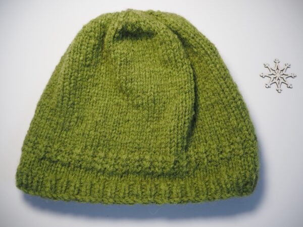 green hand knitted hat